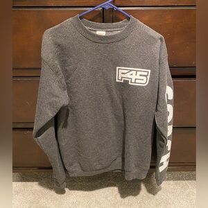 F45 coach sweater